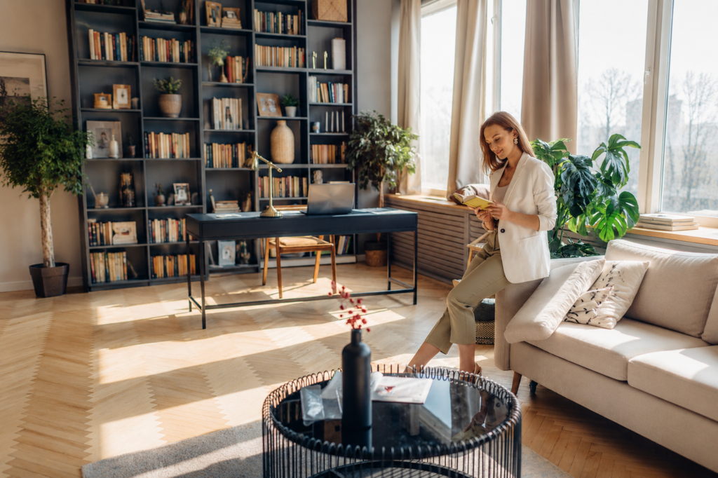 Woman reading in a calm home environment designed for focus and wellbeing